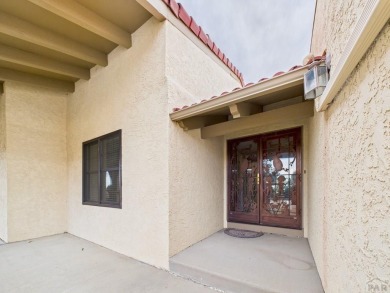 Spacious 2,028 sq ft Spanish Mediterranean-style townhome on Desert Hawk At Pueblo West in Colorado - for sale on GolfHomes.com, golf home, golf lot