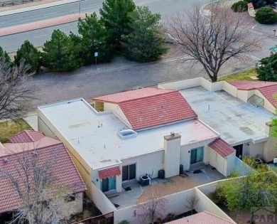 Spacious 2,028 sq ft Spanish Mediterranean-style townhome on Desert Hawk At Pueblo West in Colorado - for sale on GolfHomes.com, golf home, golf lot