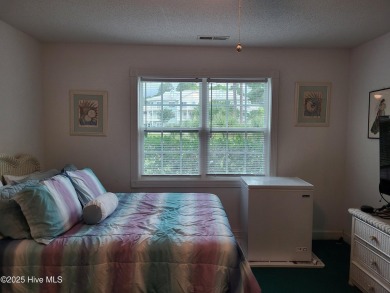 Priced over $20,000 below similar units--this ground-floor on Brunswick Plantation and Golf Resorts in North Carolina - for sale on GolfHomes.com, golf home, golf lot
