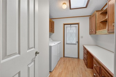 This beautiful open floorplan 2 bedroom/2 bath overlooks some of on Zellwood Station Country Club in Florida - for sale on GolfHomes.com, golf home, golf lot