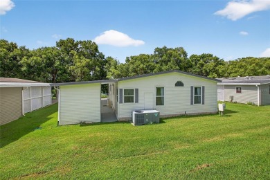 This beautiful open floorplan 2 bedroom/2 bath overlooks some of on Zellwood Station Country Club in Florida - for sale on GolfHomes.com, golf home, golf lot