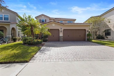 Discover luxury living in this exquisite five-bedroom on Eagle Creek Golf Club in Florida - for sale on GolfHomes.com, golf home, golf lot