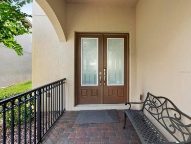 Discover luxury living in this exquisite five-bedroom on Eagle Creek Golf Club in Florida - for sale on GolfHomes.com, golf home, golf lot