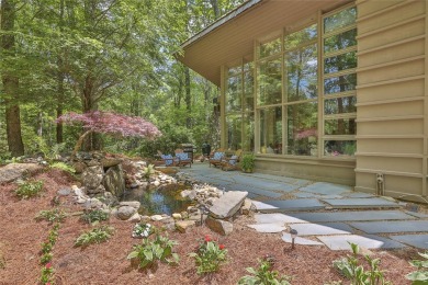Discover a bright and airy home in Wildcat Cliffs Country Club on Wildcat Cliffs Country Club in North Carolina - for sale on GolfHomes.com, golf home, golf lot