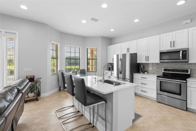 Discover luxury living in this exquisite five-bedroom on Eagle Creek Golf Club in Florida - for sale on GolfHomes.com, golf home, golf lot