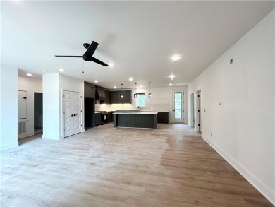 New construction on a spacious .31-acre wooded lot with a level on Bella Vista - Metfield Golf Complex and Country Club in Arkansas - for sale on GolfHomes.com, golf home, golf lot