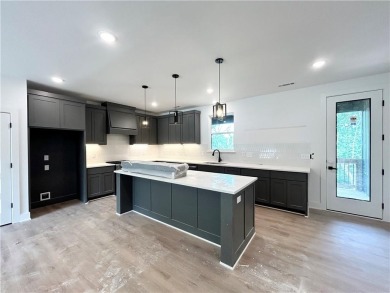 New construction on a spacious .31-acre wooded lot with a level on Bella Vista - Metfield Golf Complex and Country Club in Arkansas - for sale on GolfHomes.com, golf home, golf lot