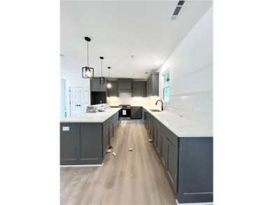 New construction on a spacious .31-acre wooded lot with a level on Bella Vista - Metfield Golf Complex and Country Club in Arkansas - for sale on GolfHomes.com, golf home, golf lot