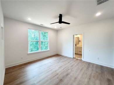 New construction on a spacious .31-acre wooded lot with a level on Bella Vista - Metfield Golf Complex and Country Club in Arkansas - for sale on GolfHomes.com, golf home, golf lot