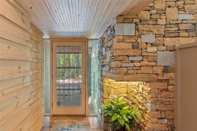 Discover a bright and airy home in Wildcat Cliffs Country Club on Wildcat Cliffs Country Club in North Carolina - for sale on GolfHomes.com, golf home, golf lot
