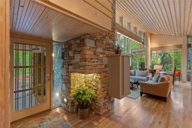 Discover a bright and airy home in Wildcat Cliffs Country Club on Wildcat Cliffs Country Club in North Carolina - for sale on GolfHomes.com, golf home, golf lot