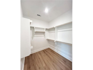 New construction on a spacious .31-acre wooded lot with a level on Bella Vista - Metfield Golf Complex and Country Club in Arkansas - for sale on GolfHomes.com, golf home, golf lot