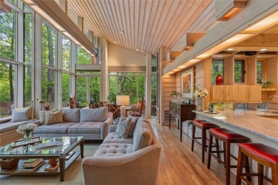 Discover a bright and airy home in Wildcat Cliffs Country Club on Wildcat Cliffs Country Club in North Carolina - for sale on GolfHomes.com, golf home, golf lot
