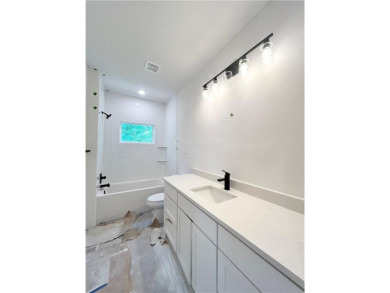 New construction on a spacious .31-acre wooded lot with a level on Bella Vista - Metfield Golf Complex and Country Club in Arkansas - for sale on GolfHomes.com, golf home, golf lot