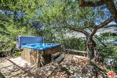 Welcome to the Chalet on the Hill, a stunning storybook home on Woodland Hills Country Club in California - for sale on GolfHomes.com, golf home, golf lot