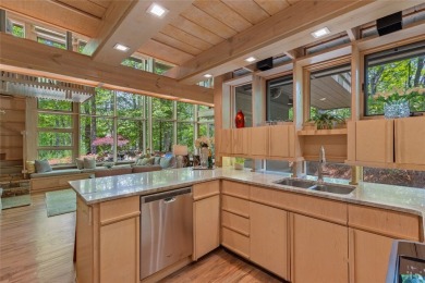 Discover a bright and airy home in Wildcat Cliffs Country Club on Wildcat Cliffs Country Club in North Carolina - for sale on GolfHomes.com, golf home, golf lot