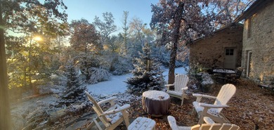 Tucked beneath a canopy of towering trees, located on a quiet on Biltmore Country Club in Illinois - for sale on GolfHomes.com, golf home, golf lot