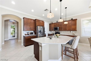 Stunning lakefront home in the desirable Materita neighborhood on Pelican Preserve Golf Club in Florida - for sale on GolfHomes.com, golf home, golf lot