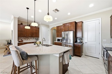 Stunning lakefront home in the desirable Materita neighborhood on Pelican Preserve Golf Club in Florida - for sale on GolfHomes.com, golf home, golf lot