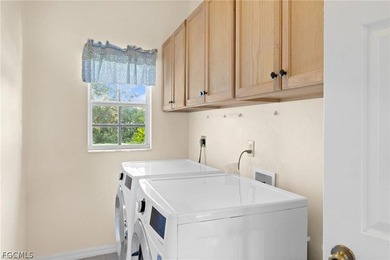 A charming front porch welcomes you to this spacious 1,782sf on Mirror Lakes Golf Club in Florida - for sale on GolfHomes.com, golf home, golf lot