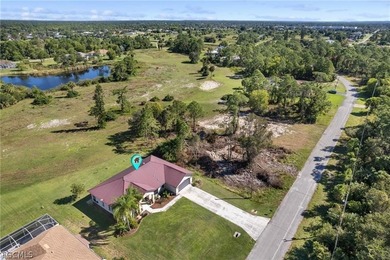 A charming front porch welcomes you to this spacious 1,782sf on Mirror Lakes Golf Club in Florida - for sale on GolfHomes.com, golf home, golf lot