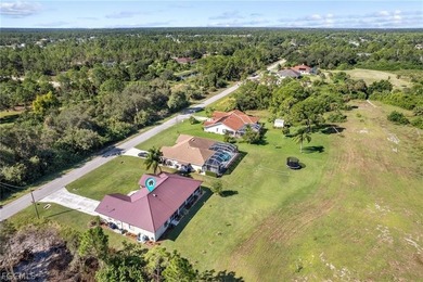 A charming front porch welcomes you to this spacious 1,782sf on Mirror Lakes Golf Club in Florida - for sale on GolfHomes.com, golf home, golf lot