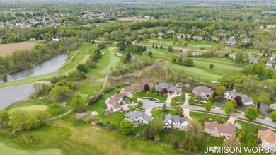 Overlooking the serene 2nd hole at the prestigious Railside Golf on Railside Golf Club in Michigan - for sale on GolfHomes.com, golf home, golf lot