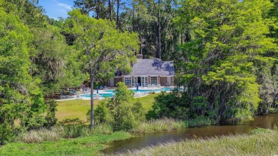Step into timeless Southern elegance at 25 Northwoods Ct, a on Willbrook Plantation Golf Club in South Carolina - for sale on GolfHomes.com, golf home, golf lot