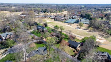 Golfer's Paradise: Perched on the scenic 18th hole of the on Rock Barn Golf and Spa in North Carolina - for sale on GolfHomes.com, golf home, golf lot