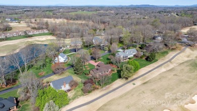 Golfer's Paradise: Perched on the scenic 18th hole of the on Rock Barn Golf and Spa in North Carolina - for sale on GolfHomes.com, golf home, golf lot
