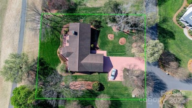 Golfer's Paradise: Perched on the scenic 18th hole of the on Rock Barn Golf and Spa in North Carolina - for sale on GolfHomes.com, golf home, golf lot