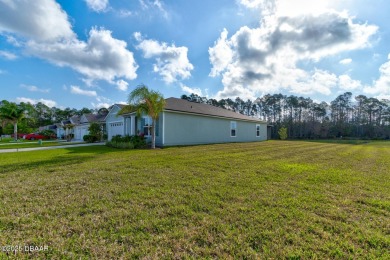 Discover this stunning lake-view home on a spacious corner lot! on Grand Reserve Golf Course in Florida - for sale on GolfHomes.com, golf home, golf lot