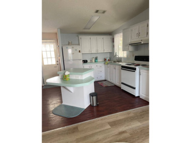 Welcome to your dream retreat! This cute Little Blue Cottage is on Blue Heron Pines Golf Course in Florida - for sale on GolfHomes.com, golf home, golf lot