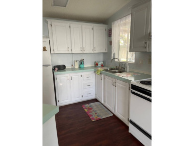 Welcome to your dream retreat! This cute Little Blue Cottage is on Blue Heron Pines Golf Course in Florida - for sale on GolfHomes.com, golf home, golf lot