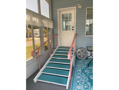 Welcome to your dream retreat! This cute Little Blue Cottage is on Blue Heron Pines Golf Course in Florida - for sale on GolfHomes.com, golf home, golf lot