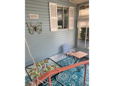 Welcome to your dream retreat! This cute Little Blue Cottage is on Blue Heron Pines Golf Course in Florida - for sale on GolfHomes.com, golf home, golf lot