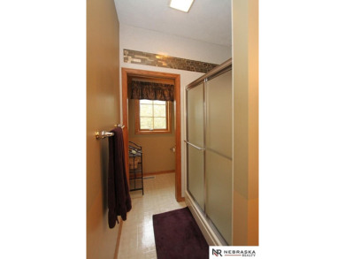 Beautiful all-brick ranch by Kinning Sydow featuring 4 bedrooms on Woodland Hills Golf Course in Nebraska - for sale on GolfHomes.com, golf home, golf lot