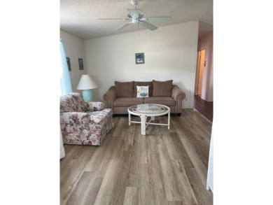 Welcome to your dream retreat! This cute Little Blue Cottage is on Blue Heron Pines Golf Course in Florida - for sale on GolfHomes.com, golf home, golf lot
