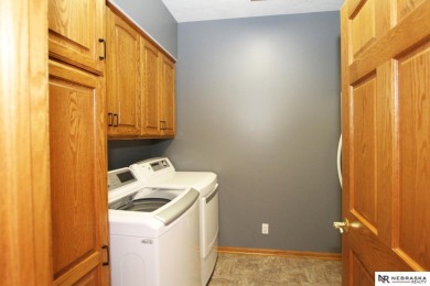 Beautiful all-brick ranch by Kinning Sydow featuring 4 bedrooms on Woodland Hills Golf Course in Nebraska - for sale on GolfHomes.com, golf home, golf lot