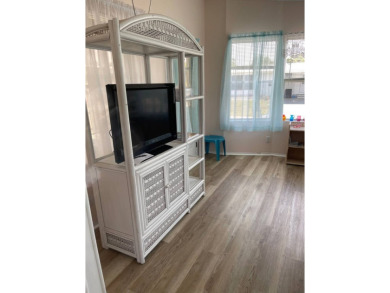 Welcome to your dream retreat! This cute Little Blue Cottage is on Blue Heron Pines Golf Course in Florida - for sale on GolfHomes.com, golf home, golf lot