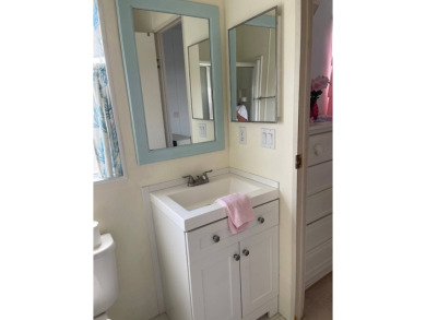 Welcome to your dream retreat! This cute Little Blue Cottage is on Blue Heron Pines Golf Course in Florida - for sale on GolfHomes.com, golf home, golf lot