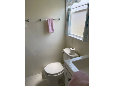 Welcome to your dream retreat! This cute Little Blue Cottage is on Blue Heron Pines Golf Course in Florida - for sale on GolfHomes.com, golf home, golf lot