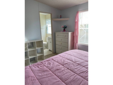 Welcome to your dream retreat! This cute Little Blue Cottage is on Blue Heron Pines Golf Course in Florida - for sale on GolfHomes.com, golf home, golf lot