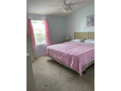 Welcome to your dream retreat! This cute Little Blue Cottage is on Blue Heron Pines Golf Course in Florida - for sale on GolfHomes.com, golf home, golf lot