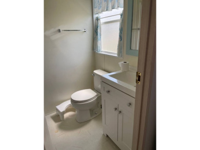 Welcome to your dream retreat! This cute Little Blue Cottage is on Blue Heron Pines Golf Course in Florida - for sale on GolfHomes.com, golf home, golf lot