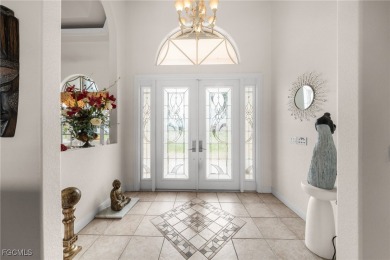 NEVER FLOODED ON THE INSIDE! LOW FLOOD INSURANCE COSTS! This on Royal Tee Country Club in Florida - for sale on GolfHomes.com, golf home, golf lot