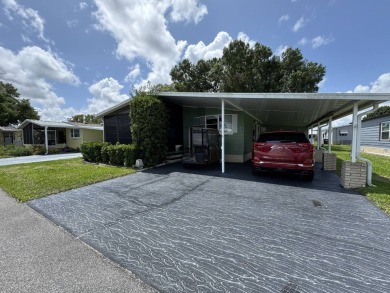 Don't miss this immaculate 2/2, 1248 sf home in the highly on Lake Henry Golf Club in Florida - for sale on GolfHomes.com, golf home, golf lot