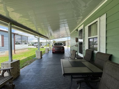 Don't miss this immaculate 2/2, 1248 sf home in the highly on Lake Henry Golf Club in Florida - for sale on GolfHomes.com, golf home, golf lot