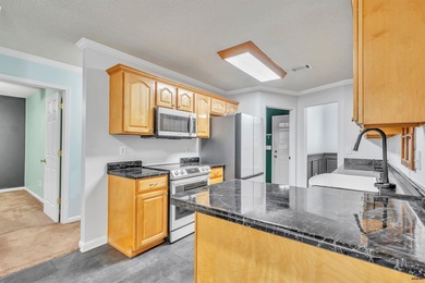 Welcome to this spacious 4-bedroom, 2-bath home in the highly on The International City Golf Course in Georgia - for sale on GolfHomes.com, golf home, golf lot