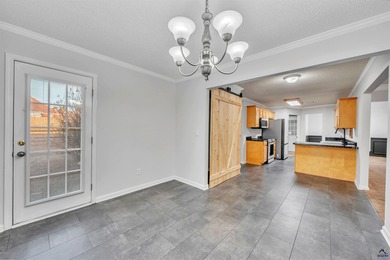 Welcome to this spacious 4-bedroom, 2-bath home in the highly on The International City Golf Course in Georgia - for sale on GolfHomes.com, golf home, golf lot